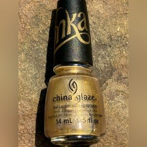Golden Sparkling “Wonka” nail polish made by China Glaze unique